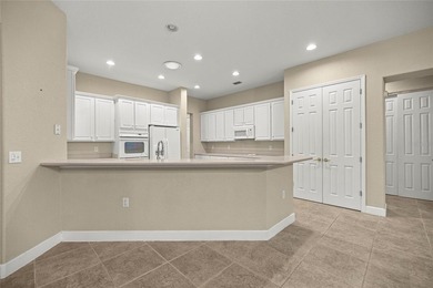 Beautiful Hampton model with concrete block construction located on Eagle Ridge At Spruce Creek Country Club in Florida - for sale on GolfHomes.com, golf home, golf lot