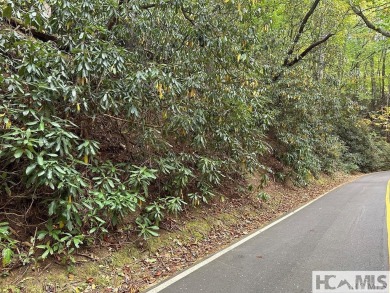 This Buildable wooded lot in Sapphire's Holly Forest features an on Sapphire National Golf Club in North Carolina - for sale on GolfHomes.com, golf home, golf lot