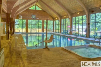 This Buildable wooded lot in Sapphire's Holly Forest features an on Sapphire National Golf Club in North Carolina - for sale on GolfHomes.com, golf home, golf lot