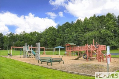 This Buildable wooded lot in Sapphire's Holly Forest features an on Sapphire National Golf Club in North Carolina - for sale on GolfHomes.com, golf home, golf lot