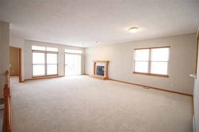 Open living room/dining room. Expensive carpet throughout. The on Hunters Ridge Golf Course in Iowa - for sale on GolfHomes.com, golf home, golf lot