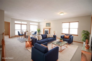 Open living room/dining room. Expensive carpet throughout. The on Hunters Ridge Golf Course in Iowa - for sale on GolfHomes.com, golf home, golf lot