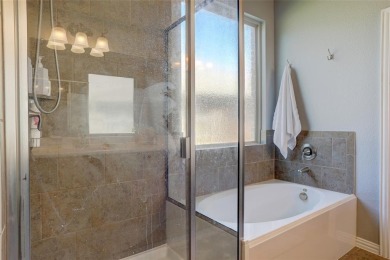 Welcome to this impeccably designed 4-bedroom, 3.5-bathroom home on Frisco Lakes Golf Course in Texas - for sale on GolfHomes.com, golf home, golf lot