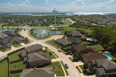 Welcome to this impeccably designed 4-bedroom, 3.5-bathroom home on Frisco Lakes Golf Course in Texas - for sale on GolfHomes.com, golf home, golf lot