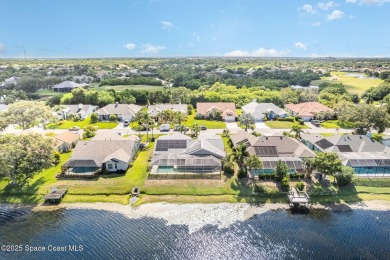 Drive up the pavered circular driveway framed by lush on Baytree National Golf Links in Florida - for sale on GolfHomes.com, golf home, golf lot