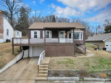 This lovingly maintained 3-bedroom, 1-bathroom bungalow offers a on Riverside Golf Club - Riverside in Missouri - for sale on GolfHomes.com, golf home, golf lot