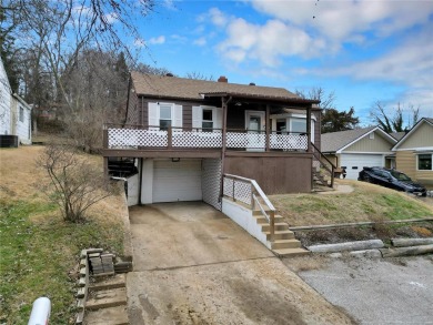 This lovingly maintained 3-bedroom, 1-bathroom bungalow offers a on Riverside Golf Club - Riverside in Missouri - for sale on GolfHomes.com, golf home, golf lot