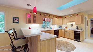 Welcome to this charming and spacious one-story home situated on on Whispering Pines Golf Course in North Carolina - for sale on GolfHomes.com, golf home, golf lot