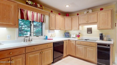 Welcome to this charming and spacious one-story home situated on on Whispering Pines Golf Course in North Carolina - for sale on GolfHomes.com, golf home, golf lot