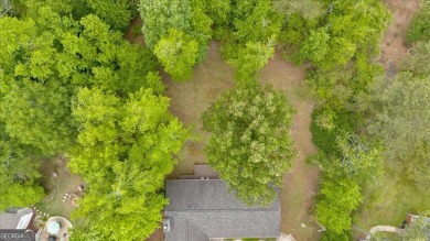 Discover this charming 3-bedroom, 2-bath ranch-style home on Fairfield Plantation Golf and Country Club in Georgia - for sale on GolfHomes.com, golf home, golf lot