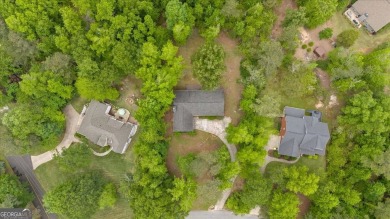 Discover this charming 3-bedroom, 2-bath ranch-style home on Fairfield Plantation Golf and Country Club in Georgia - for sale on GolfHomes.com, golf home, golf lot