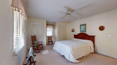 Welcome to this charming and spacious one-story home situated on on Whispering Pines Golf Course in North Carolina - for sale on GolfHomes.com, golf home, golf lot