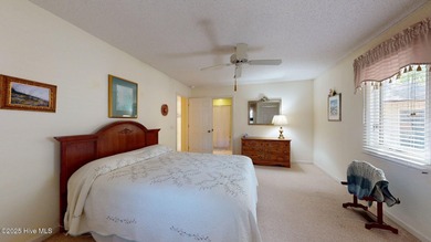 Welcome to this charming and spacious one-story home situated on on Whispering Pines Golf Course in North Carolina - for sale on GolfHomes.com, golf home, golf lot