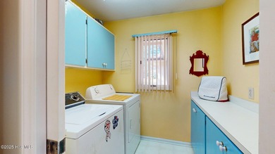 Welcome to this charming and spacious one-story home situated on on Whispering Pines Golf Course in North Carolina - for sale on GolfHomes.com, golf home, golf lot