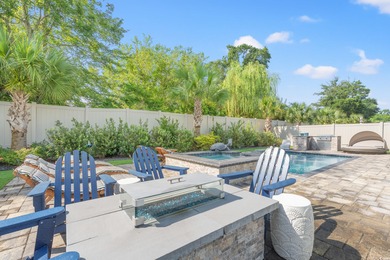 Live like you're on vacation every day in this impressive on Surf Golf and Beach Club in South Carolina - for sale on GolfHomes.com, golf home, golf lot