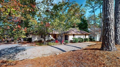 Welcome to this charming and spacious one-story home situated on on Whispering Pines Golf Course in North Carolina - for sale on GolfHomes.com, golf home, golf lot