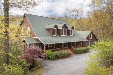 Experience breathtaking long-range mountain views and a serene on Sapphire National Golf Club in North Carolina - for sale on GolfHomes.com, golf home, golf lot