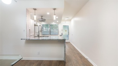 Renovated 1st Floor Condo with Water & Golf Course Views in on Wynmoor Golf Course in Florida - for sale on GolfHomes.com, golf home, golf lot