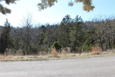 This exceptional, mostly cleared lot offers a level area perfect on Holiday Island Golf Course in Arkansas - for sale on GolfHomes.com, golf home, golf lot