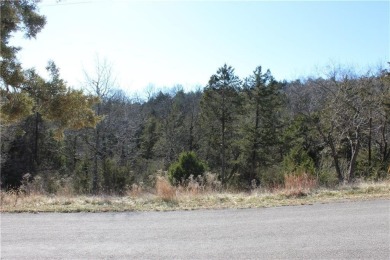 This exceptional, mostly cleared lot offers a level area perfect on Holiday Island Golf Course in Arkansas - for sale on GolfHomes.com, golf home, golf lot