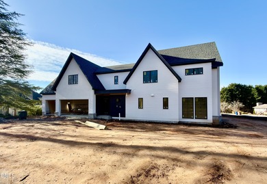 Located in a prime setting within North Raleigh's premier on North Ridge Country Club in North Carolina - for sale on GolfHomes.com, golf home, golf lot