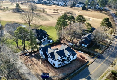 Located in a prime setting within North Raleigh's premier on North Ridge Country Club in North Carolina - for sale on GolfHomes.com, golf home, golf lot
