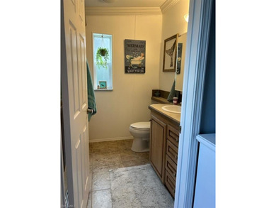 This 2008 Jacobson manufactured home is located on one of the on Pelicans Nest Golf Club in Florida - for sale on GolfHomes.com, golf home, golf lot