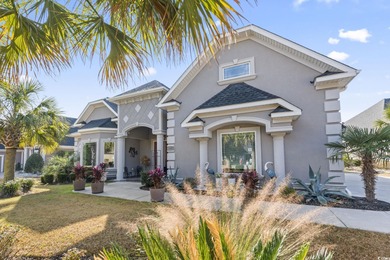 Welcome to this stunning custom-built 2021 stucco home on Wild Wing Plantation in South Carolina - for sale on GolfHomes.com, golf home, golf lot