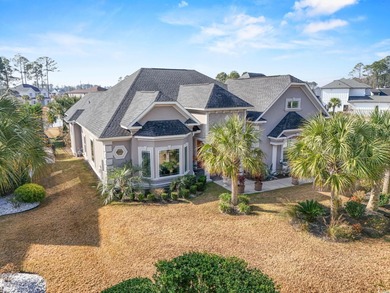 Welcome to this stunning custom-built 2021 stucco home on Wild Wing Plantation in South Carolina - for sale on GolfHomes.com, golf home, golf lot