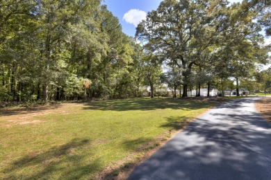 This spacious 1.01-acre partially cleared lot offers the perfect on Players Course At Wyboo Plantation in South Carolina - for sale on GolfHomes.com, golf home, golf lot