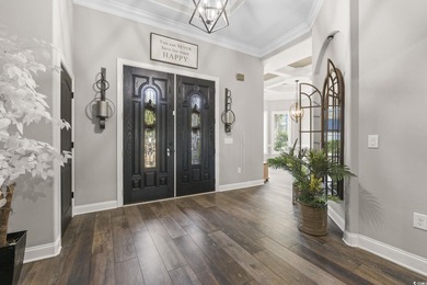 Welcome to this stunning custom-built 2021 stucco home on Wild Wing Plantation in South Carolina - for sale on GolfHomes.com, golf home, golf lot