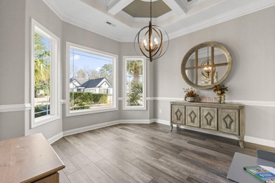Welcome to this stunning custom-built 2021 stucco home on Wild Wing Plantation in South Carolina - for sale on GolfHomes.com, golf home, golf lot