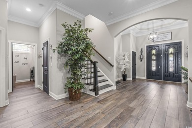 Welcome to this stunning custom-built 2021 stucco home on Wild Wing Plantation in South Carolina - for sale on GolfHomes.com, golf home, golf lot