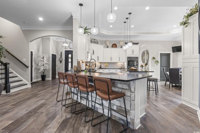 Welcome to this stunning custom-built 2021 stucco home on Wild Wing Plantation in South Carolina - for sale on GolfHomes.com, golf home, golf lot