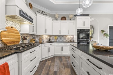 Welcome to this stunning custom-built 2021 stucco home on Wild Wing Plantation in South Carolina - for sale on GolfHomes.com, golf home, golf lot