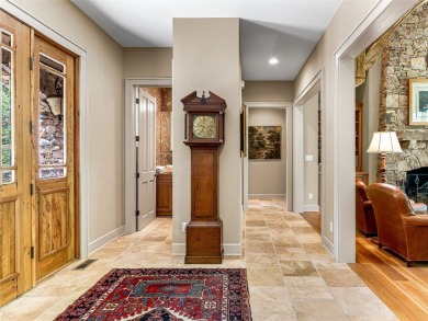 Overlooking the scenic 4th hole, this stunning 4-bedroom, 4 on Lake Toxaway Country Club in North Carolina - for sale on GolfHomes.com, golf home, golf lot