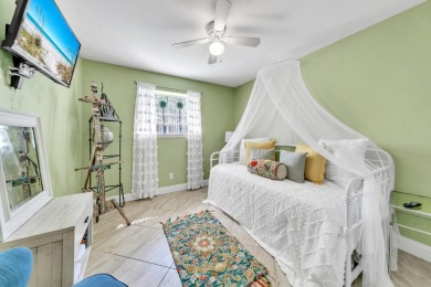 Lots of natural light streams into this cheerful beach retreat on Seascape Golf Course in Florida - for sale on GolfHomes.com, golf home, golf lot
