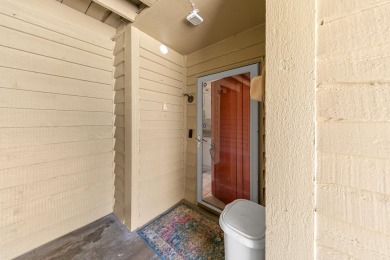 Lots of natural light streams into this cheerful beach retreat on Seascape Golf Course in Florida - for sale on GolfHomes.com, golf home, golf lot