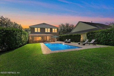 Outdoors is where you'll truly live in this gorgeous pool home on St. Johns Golf and Country Club in Florida - for sale on GolfHomes.com, golf home, golf lot