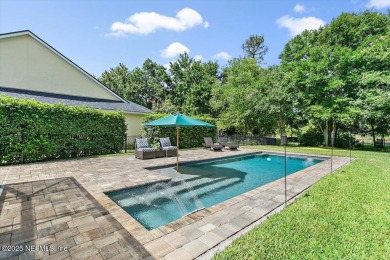 Outdoors is where you'll truly live in this gorgeous pool home on St. Johns Golf and Country Club in Florida - for sale on GolfHomes.com, golf home, golf lot