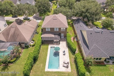 Outdoors is where you'll truly live in this gorgeous pool home on St. Johns Golf and Country Club in Florida - for sale on GolfHomes.com, golf home, golf lot