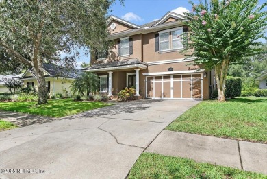 Outdoors is where you'll truly live in this gorgeous pool home on St. Johns Golf and Country Club in Florida - for sale on GolfHomes.com, golf home, golf lot