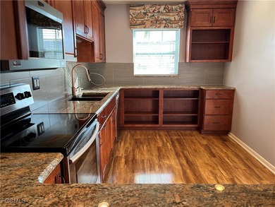 This spacious 3 bedroom unit features a gorgeous updated kitchen on Myerlee Country Club in Florida - for sale on GolfHomes.com, golf home, golf lot