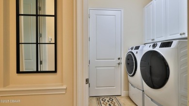 This beautifully maintained 2-bedroom, 2-bath, 2-car garage on Plantation Bay Golf and Country Club in Florida - for sale on GolfHomes.com, golf home, golf lot