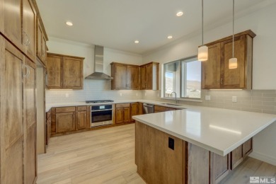 Gated community against the high desert hillside with on  in Nevada - for sale on GolfHomes.com, golf home, golf lot