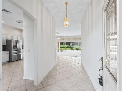 One or more photo(s) has been virtually staged. CUSTOM Magnolia on El Santiago Executive Golf Course in Florida - for sale on GolfHomes.com, golf home, golf lot