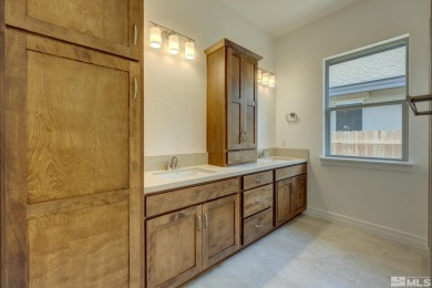 Gated community against the high desert hillside with on  in Nevada - for sale on GolfHomes.com, golf home, golf lot