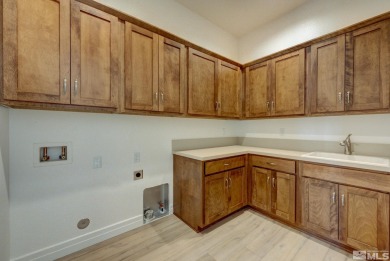 Gated community against the high desert hillside with on  in Nevada - for sale on GolfHomes.com, golf home, golf lot
