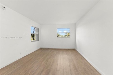 Beautiful first-floor unit featuring tile flooring throughout on Flamingo Lakes Country Club in Florida - for sale on GolfHomes.com, golf home, golf lot