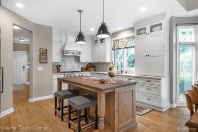This custom property is tucked away on a quiet cul-de-sac is in on Oakhurst Golf and Country Club in Michigan - for sale on GolfHomes.com, golf home, golf lot